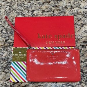 Kate Spade Glossy Harrison Street Wristlet in carnelian comes with gift box